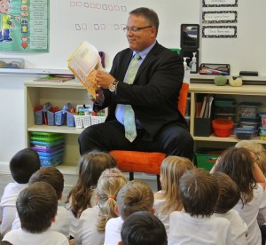 Mr. Logan reads to grade 1